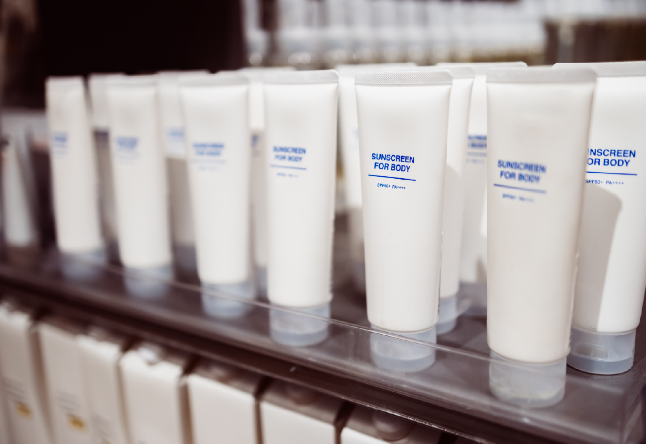A row of identical white squeeze tubes labeled 