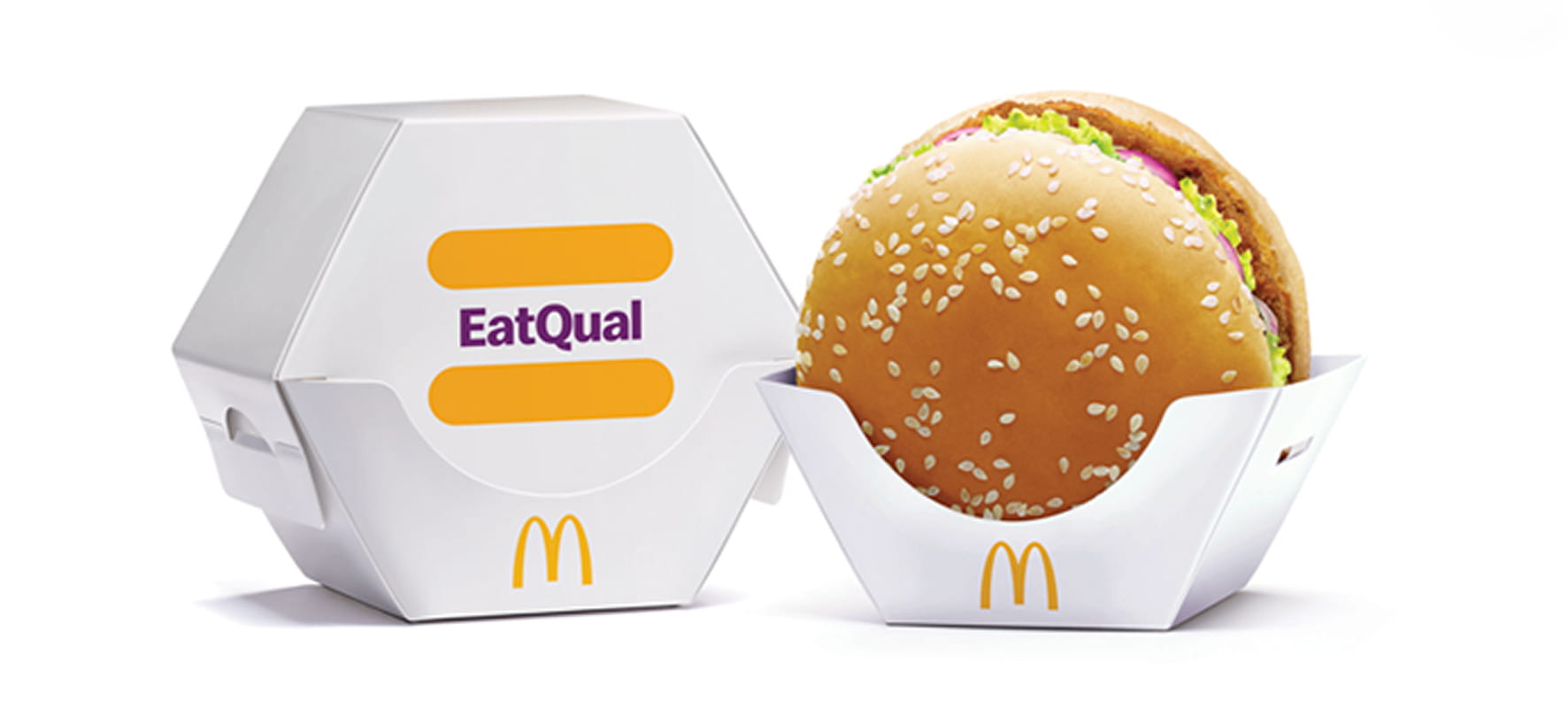 McDonald's EatQual burger packaging — a hexagonal box and open tray — designed for one-handed eating.