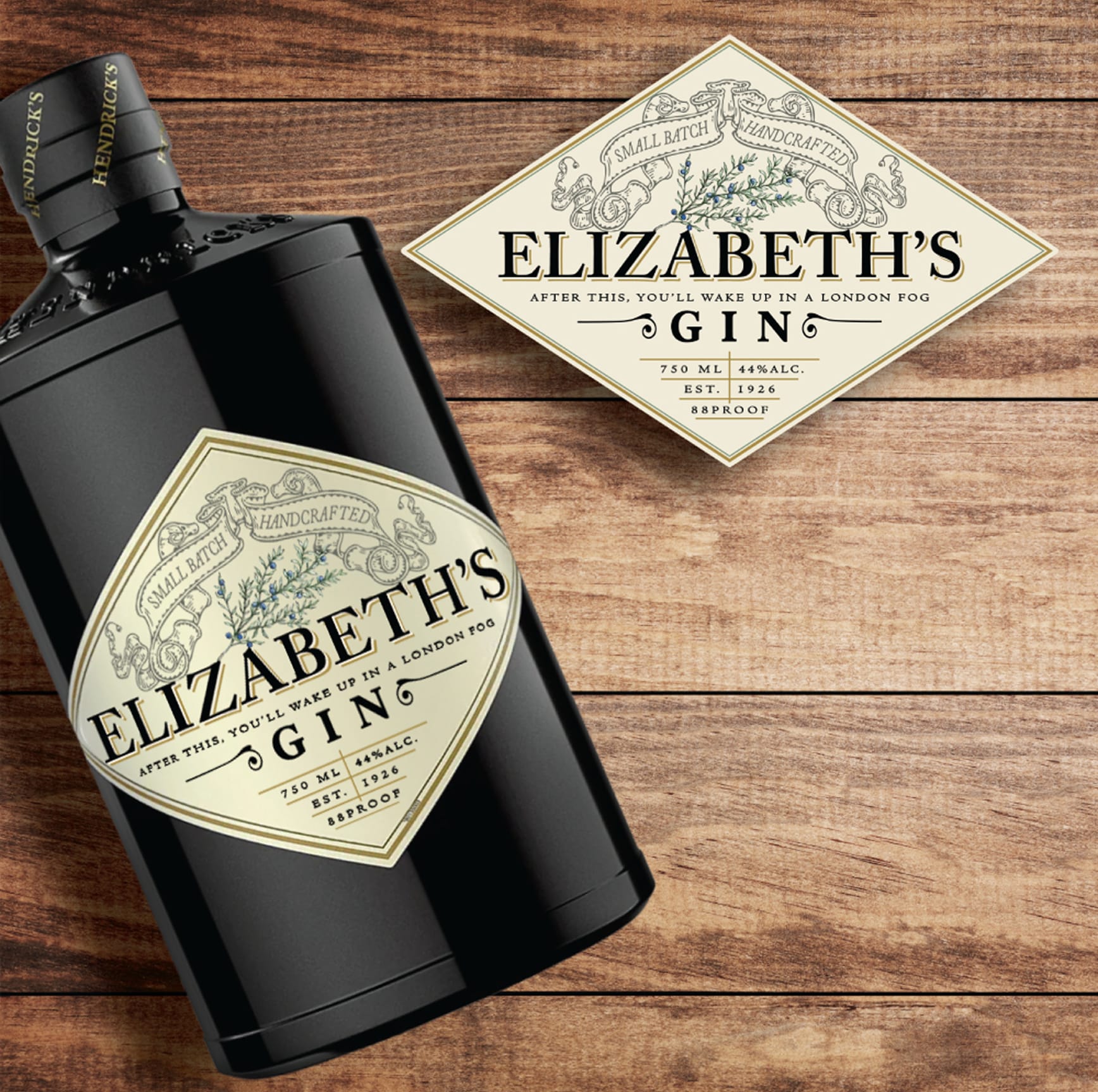 Elizabeth's Gin bottle in matte black glass with a cream vintage-style label featuring hand-drawn botanical illustration, displayed alongside a flat label mockup on a wood surface.