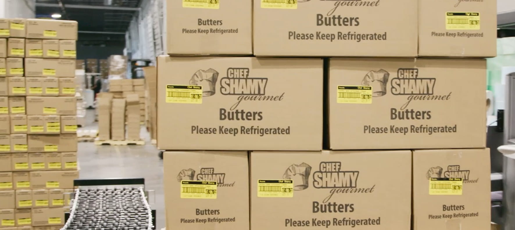 Stacked Chef Shamy Gourmet Butters cardboard shipping boxes labeled 