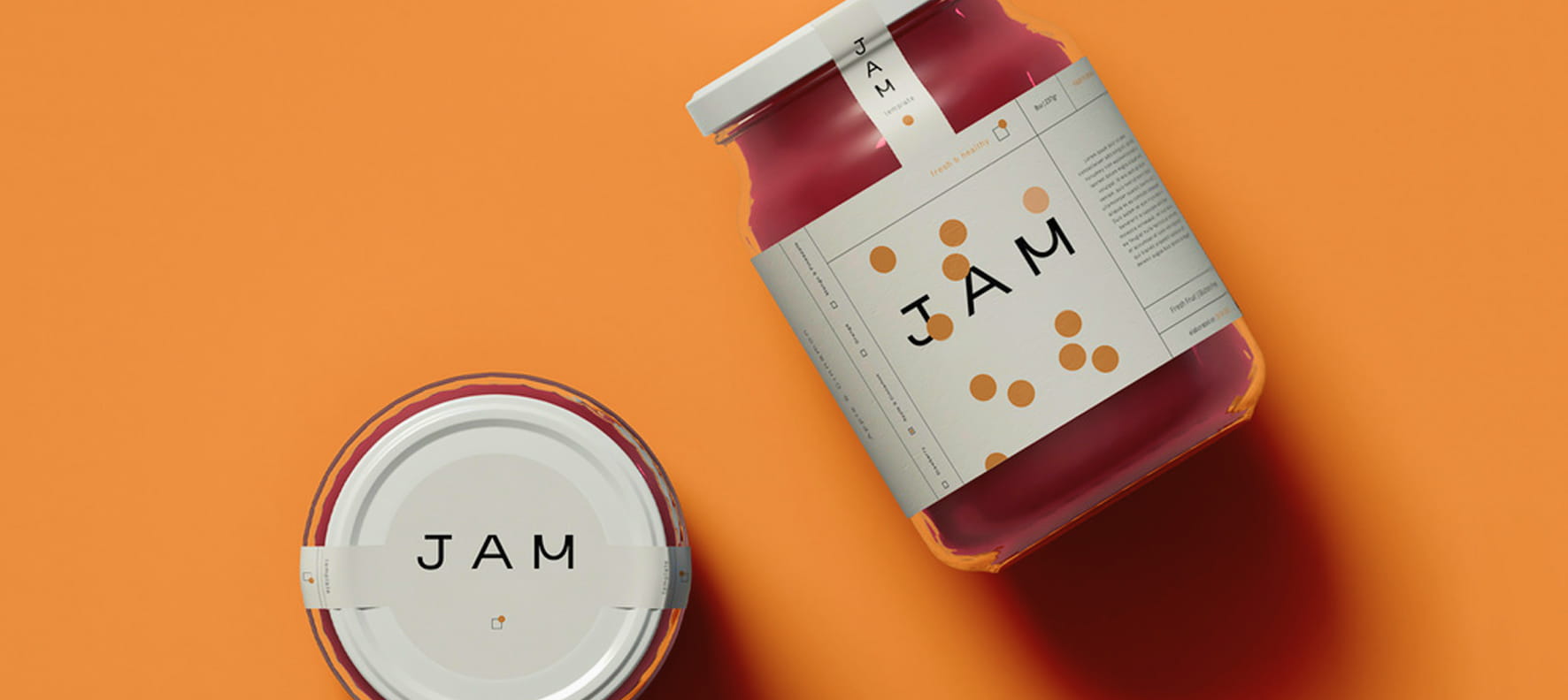 Two minimalist jam jars with cream-colored labels featuring bold 
