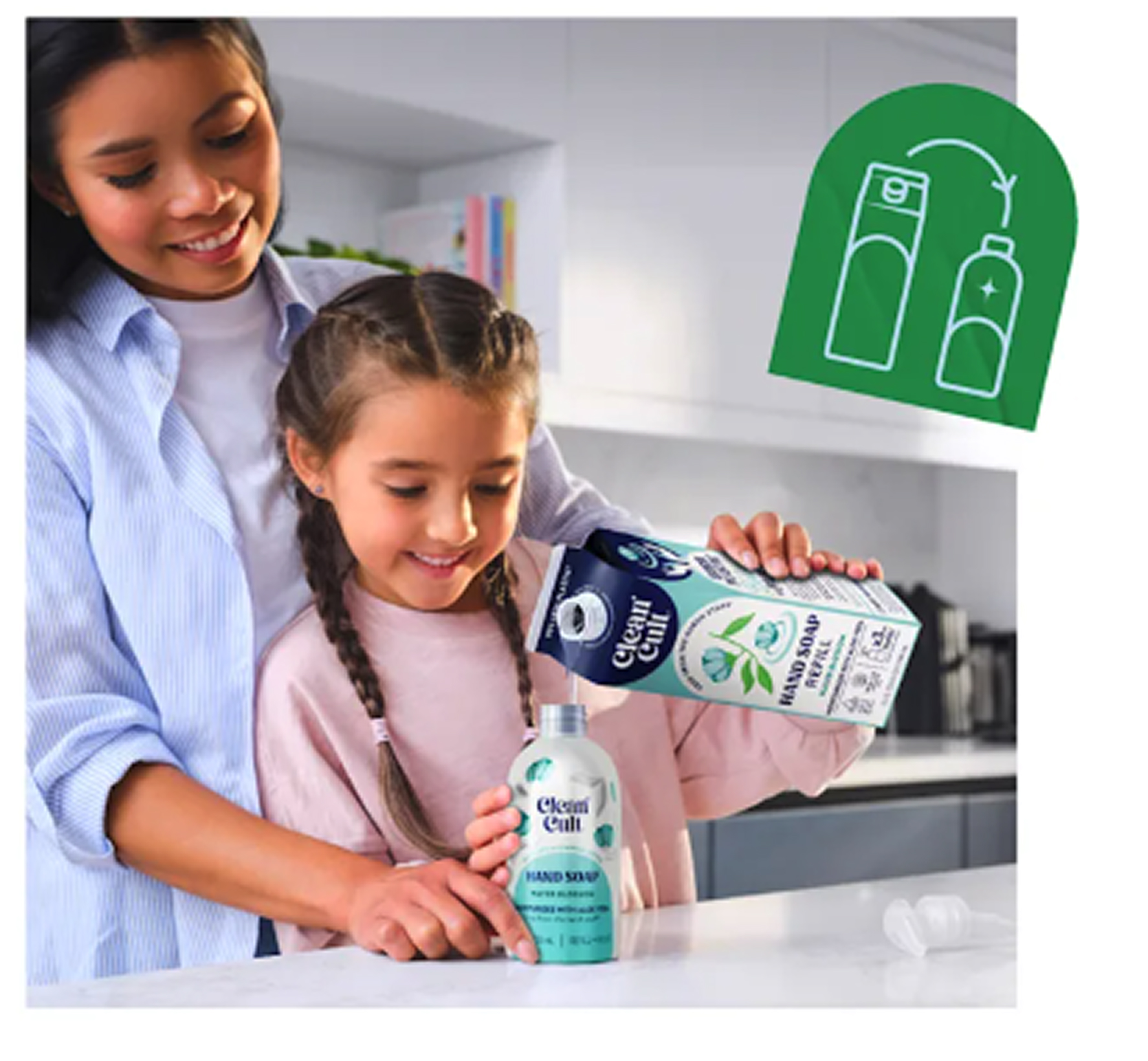 Mother and daughter pouring hand soap into reusable aluminum bottle from paper refill carton.