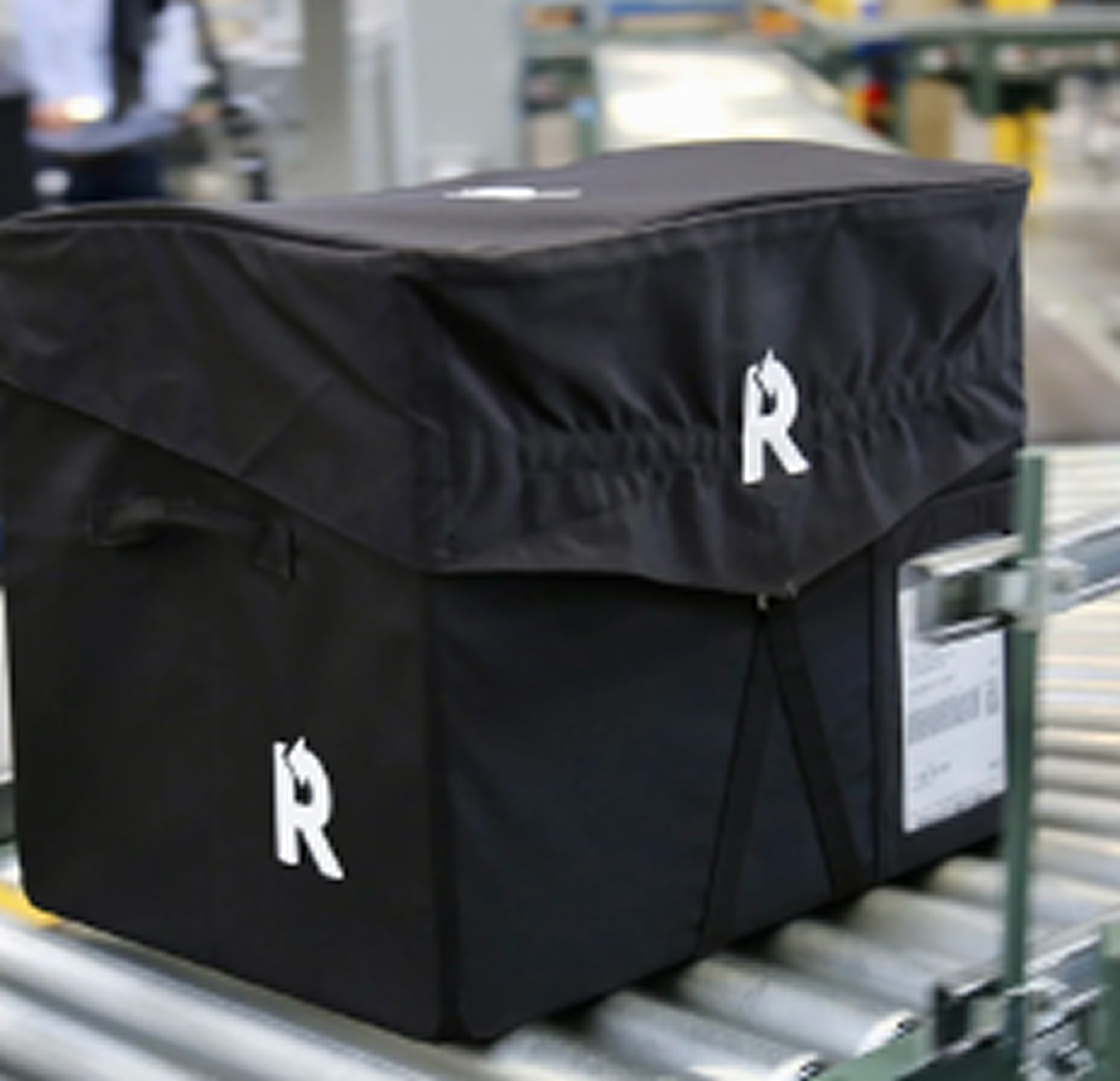 Black reusable box with Returnity brand logo